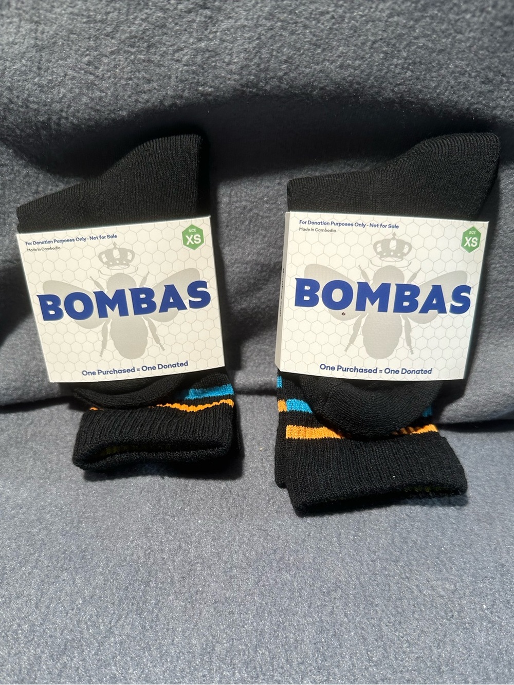 Bombas Black Crew Socks with Blue and Orange Stripe Accents